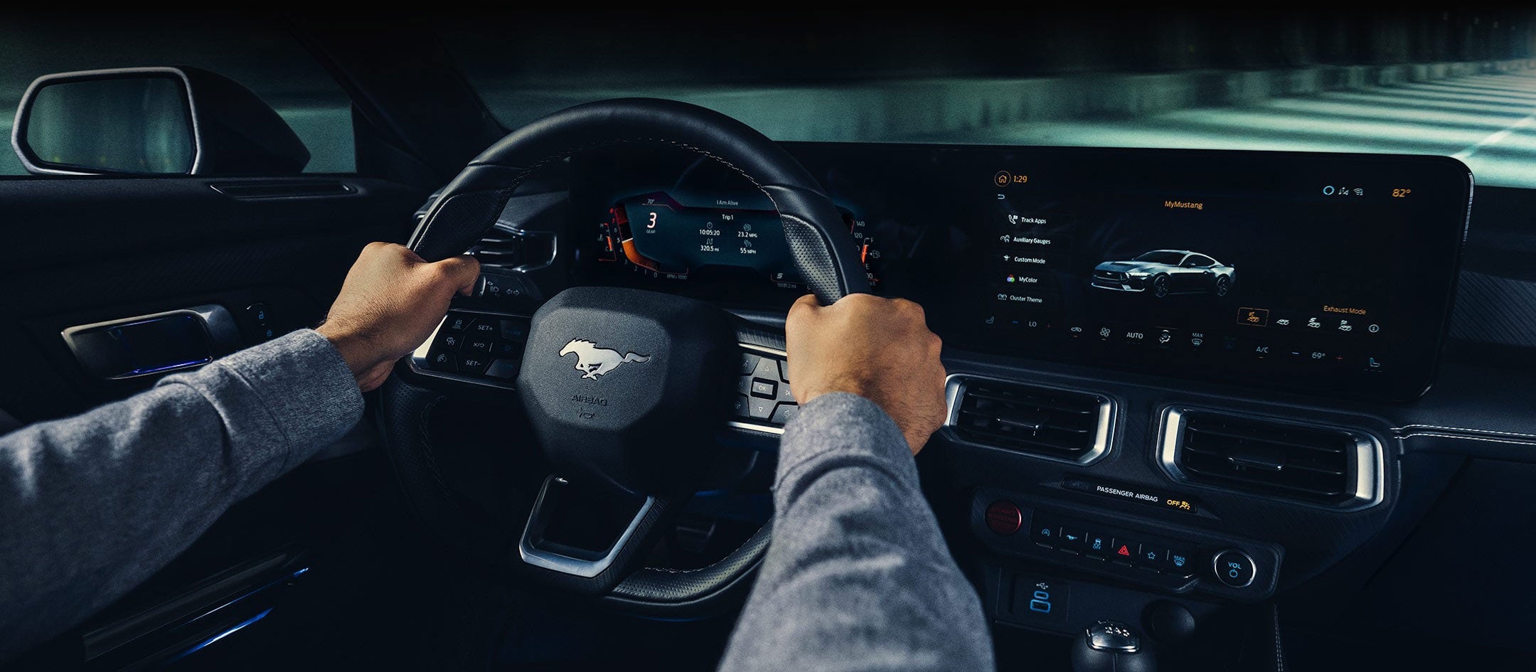 A 2024 Ford Mustang® model interior with a person driving | Bob Sight Ford Inc in Lees Summit MO